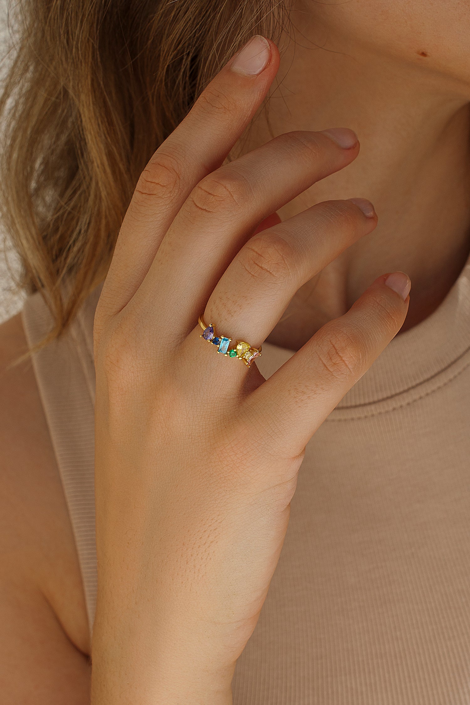 Rings with gold-plated central colored stones