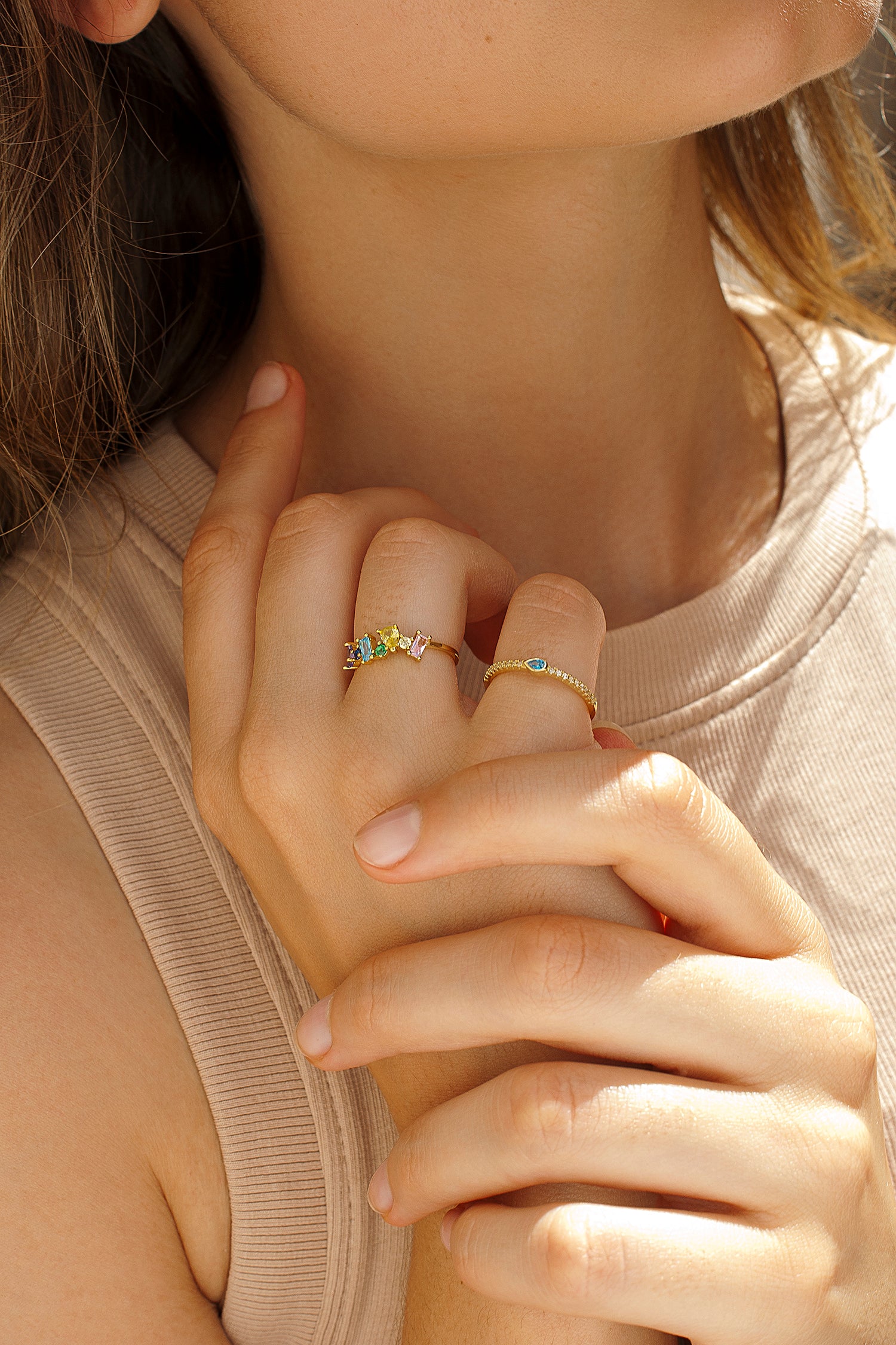 Rings with gold-plated central colored stones