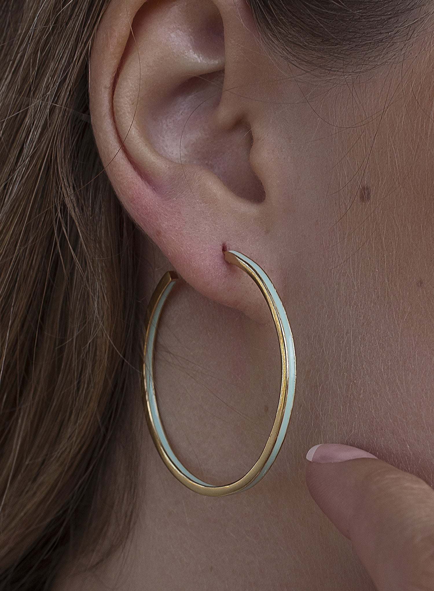 Large silver hoop earrings with mint-tone enamel design, gold-plated