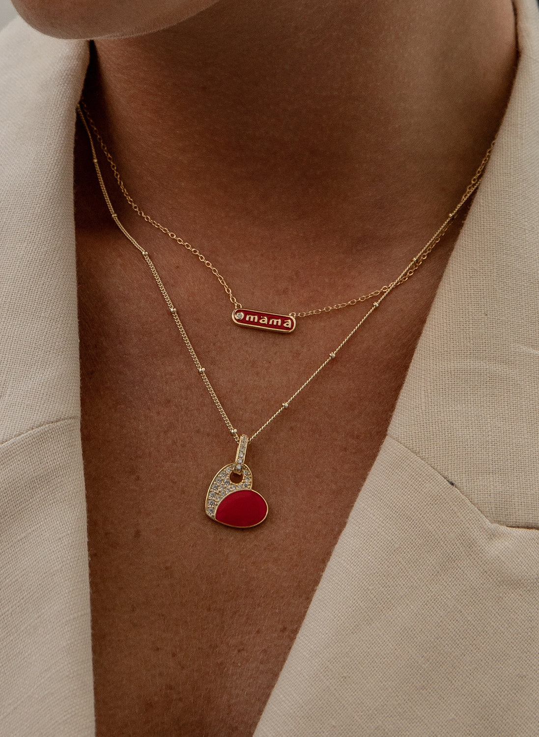 Small silver pendants with enamel "mama" design