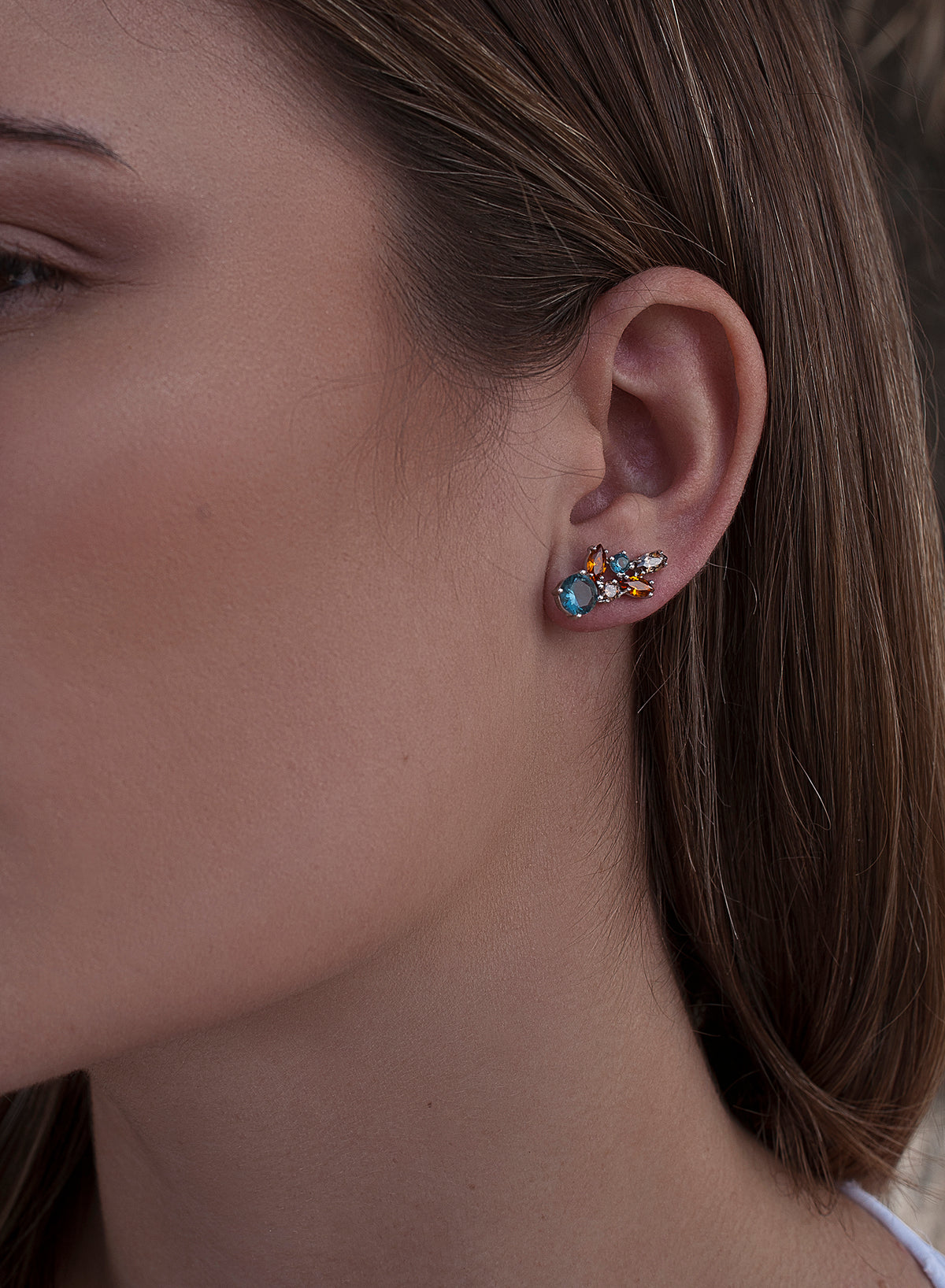 Silver climber earrings with blue leaf design