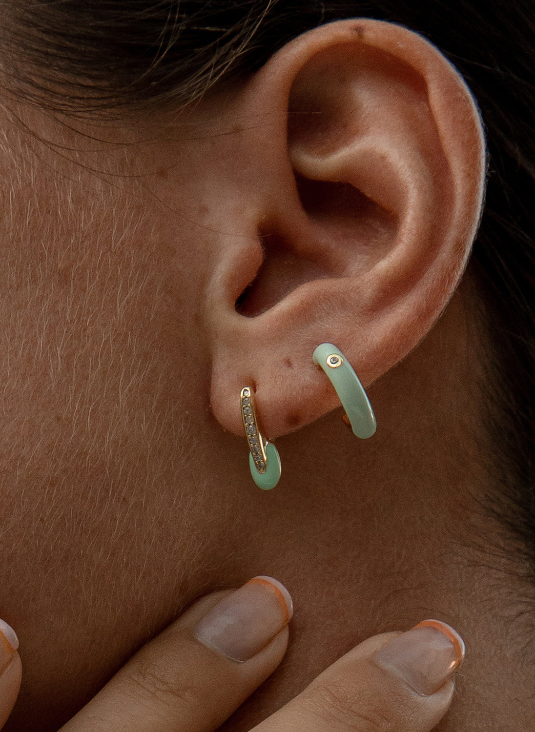 Original earrings with a "v" design combined with enamel