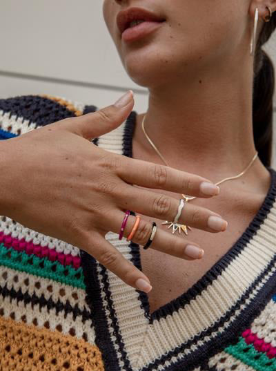 Thin silver rings with white enamel and curvilinear design
