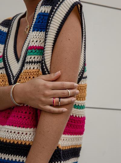 Thin silver rings with white enamel and curvilinear design
