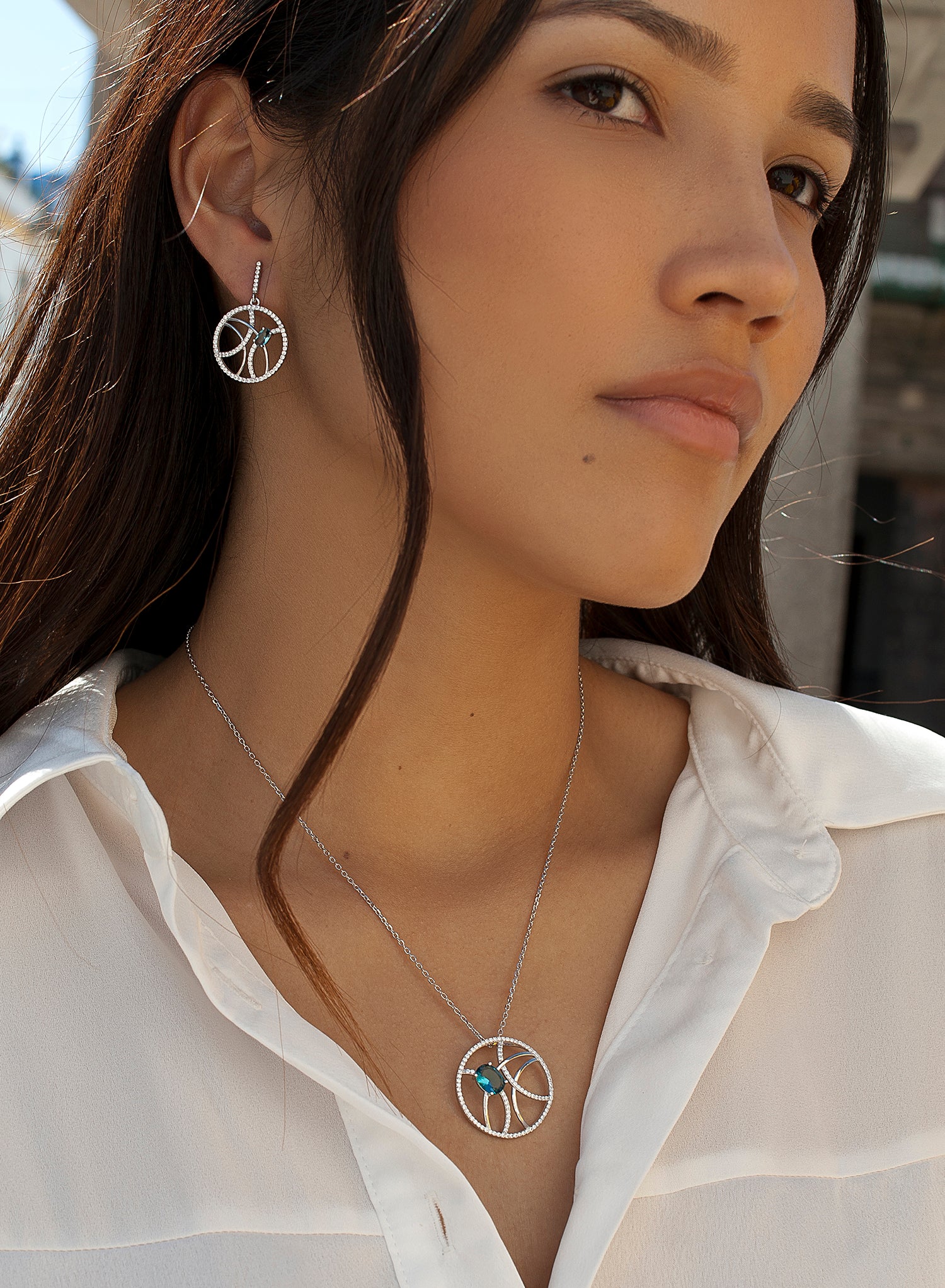 Large silver pendants with a circular aquamarine design