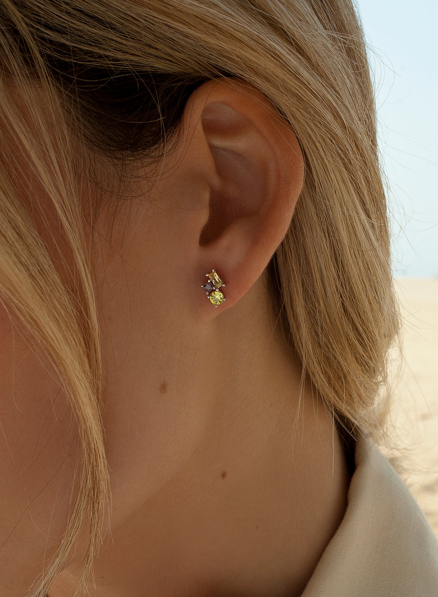 Small earrings with round cut adamantine quartz design