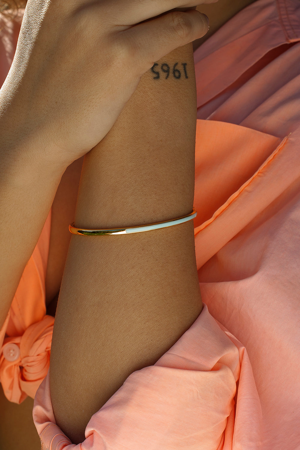 Slave bracelet with blue enamel design, gold plated