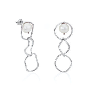 Pendientes largos detalle perla diseño de tres aros