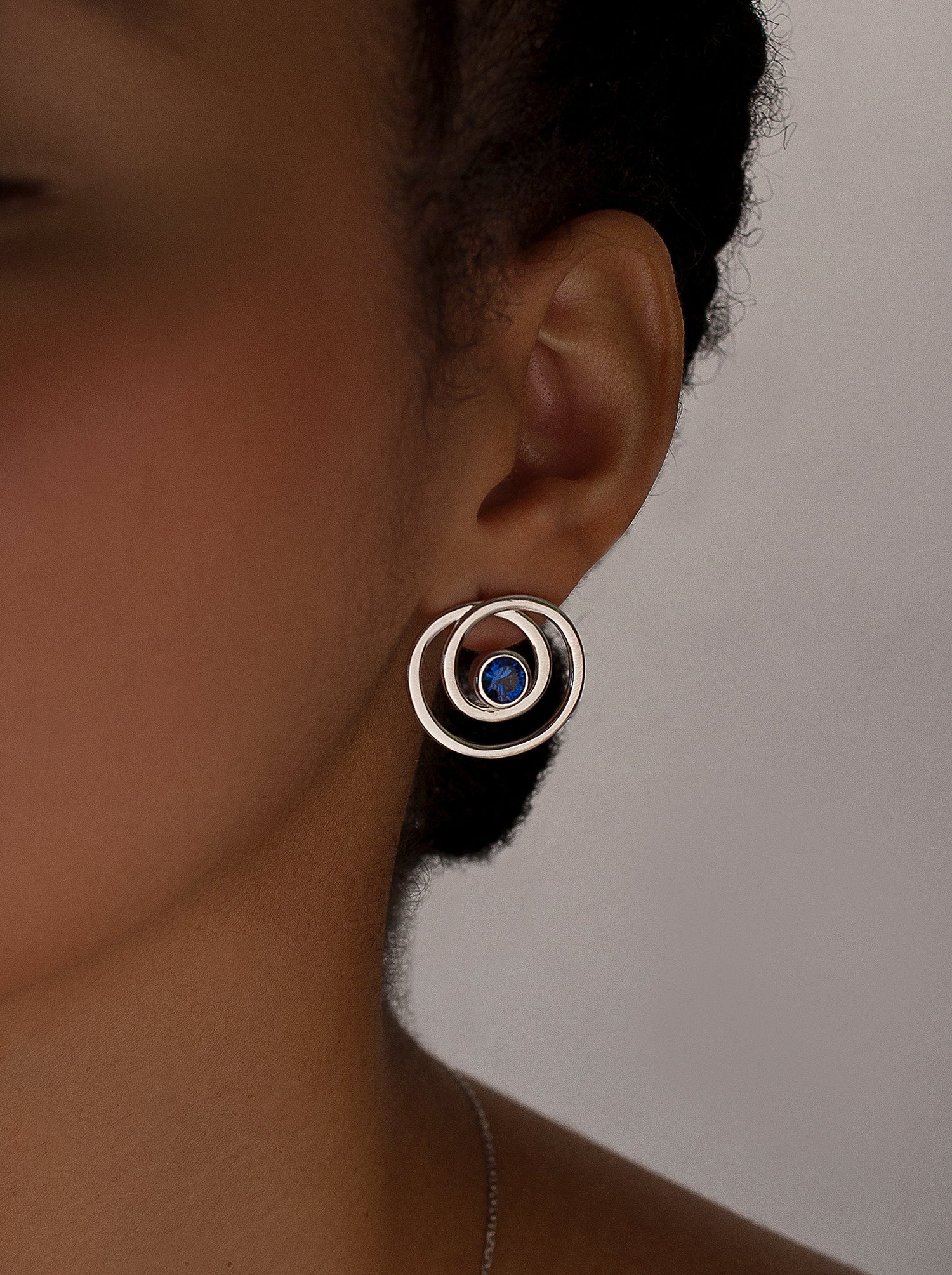 Original spiral hoop earrings with sapphire tone zirconias