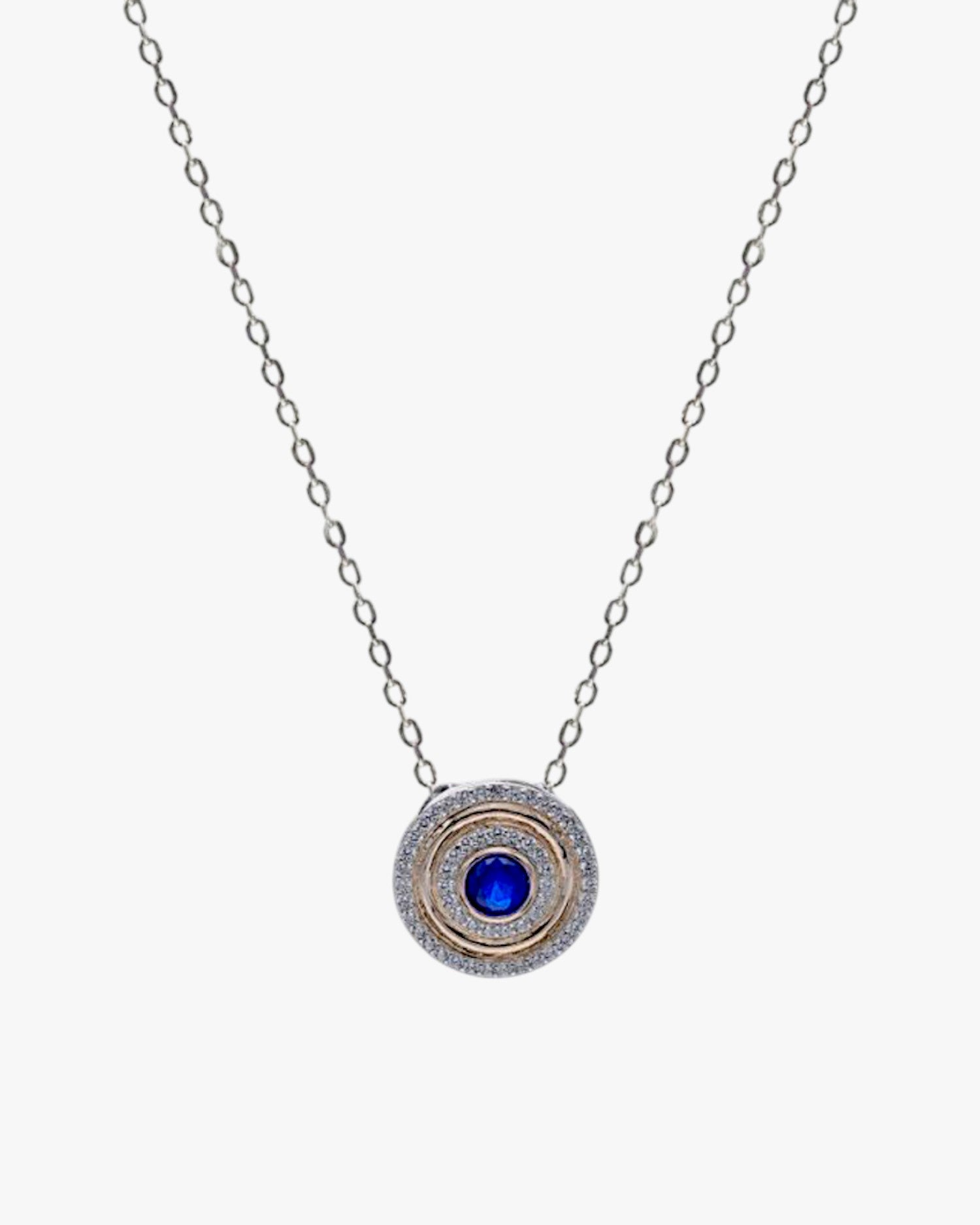 Collier médaillon orné de zirconiums cubiques et d'une pierre précieuse bleue centrale