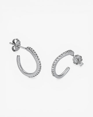 Petites boucles d'oreilles créoles au design curviligne et ornées de zirconiums cubiques