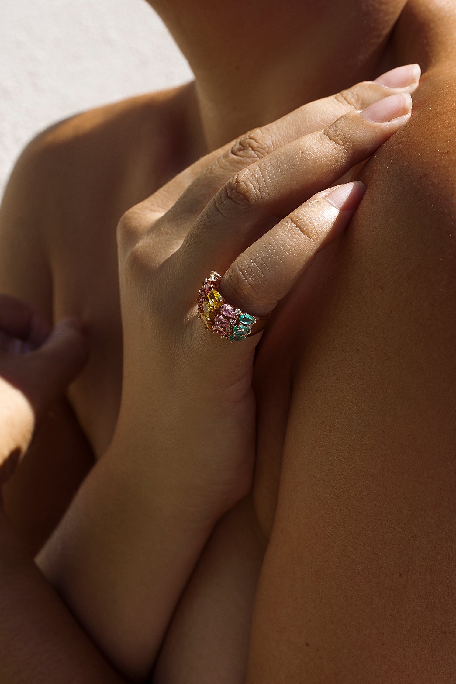 Rings with colored stones and a bow in cool tones