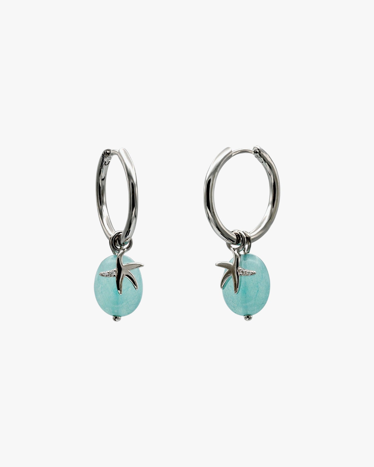Boucles d'oreilles ornées de pendentifs en argent représentant des étoiles de mer et de la turquoise
