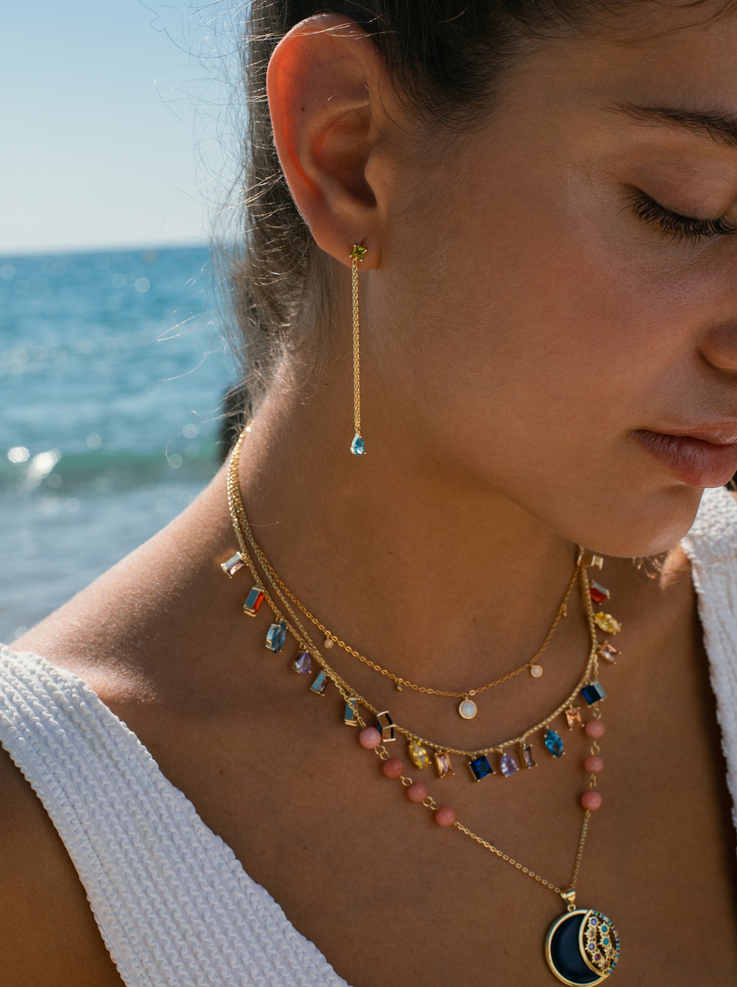 Silver medal necklace with night motif of shiny semiprecious stones and enamel