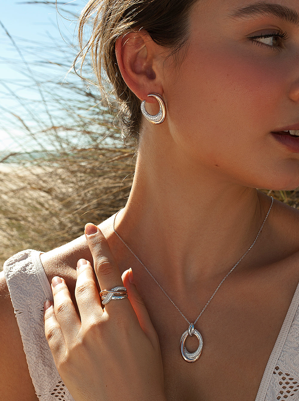 Pendientes bicolor de plata ovalados con circonitas