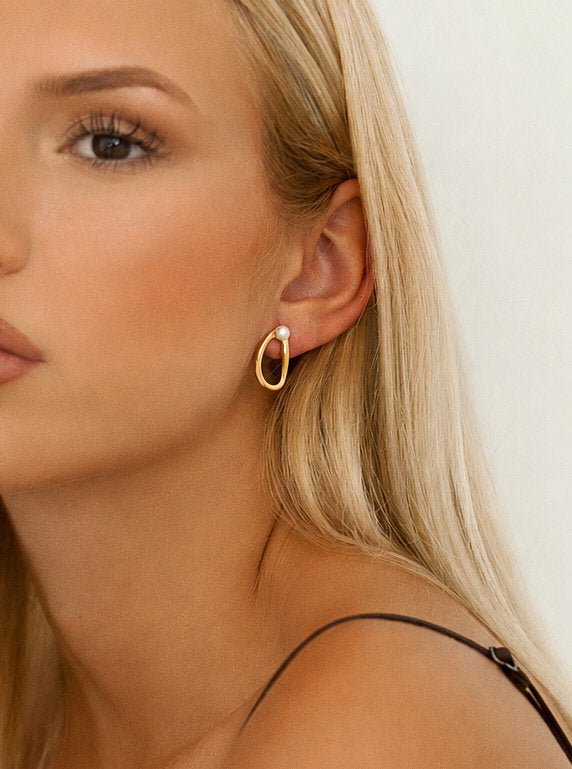 Boucles d'oreilles ovales originales en argent avec mini perle