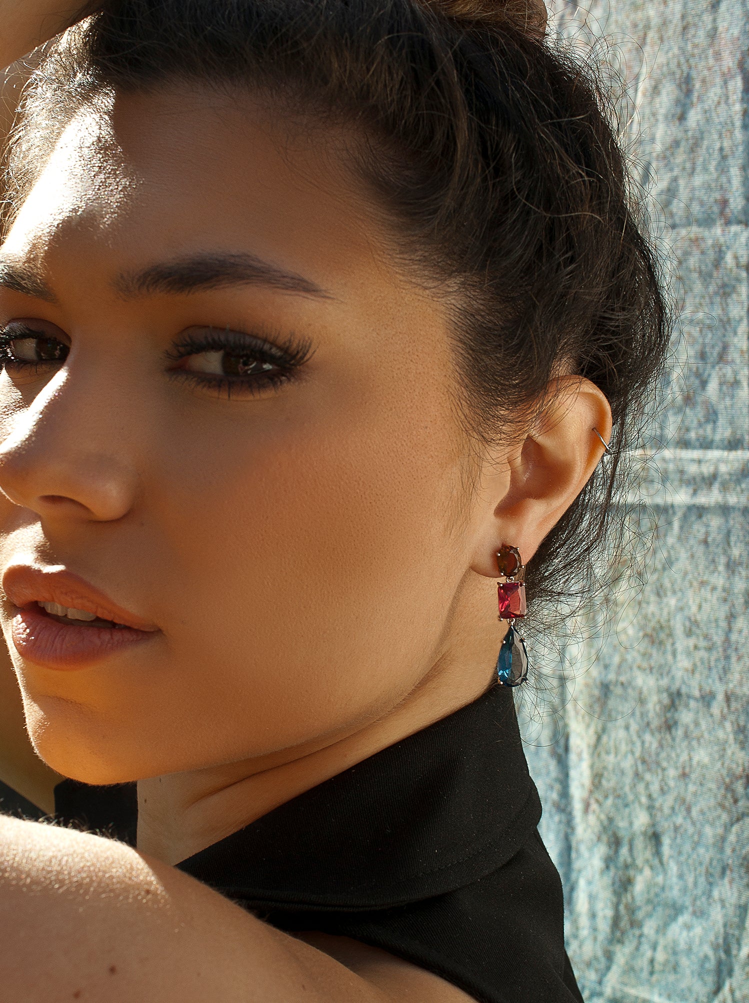 Silver earrings with colored stones in different sizes and shades