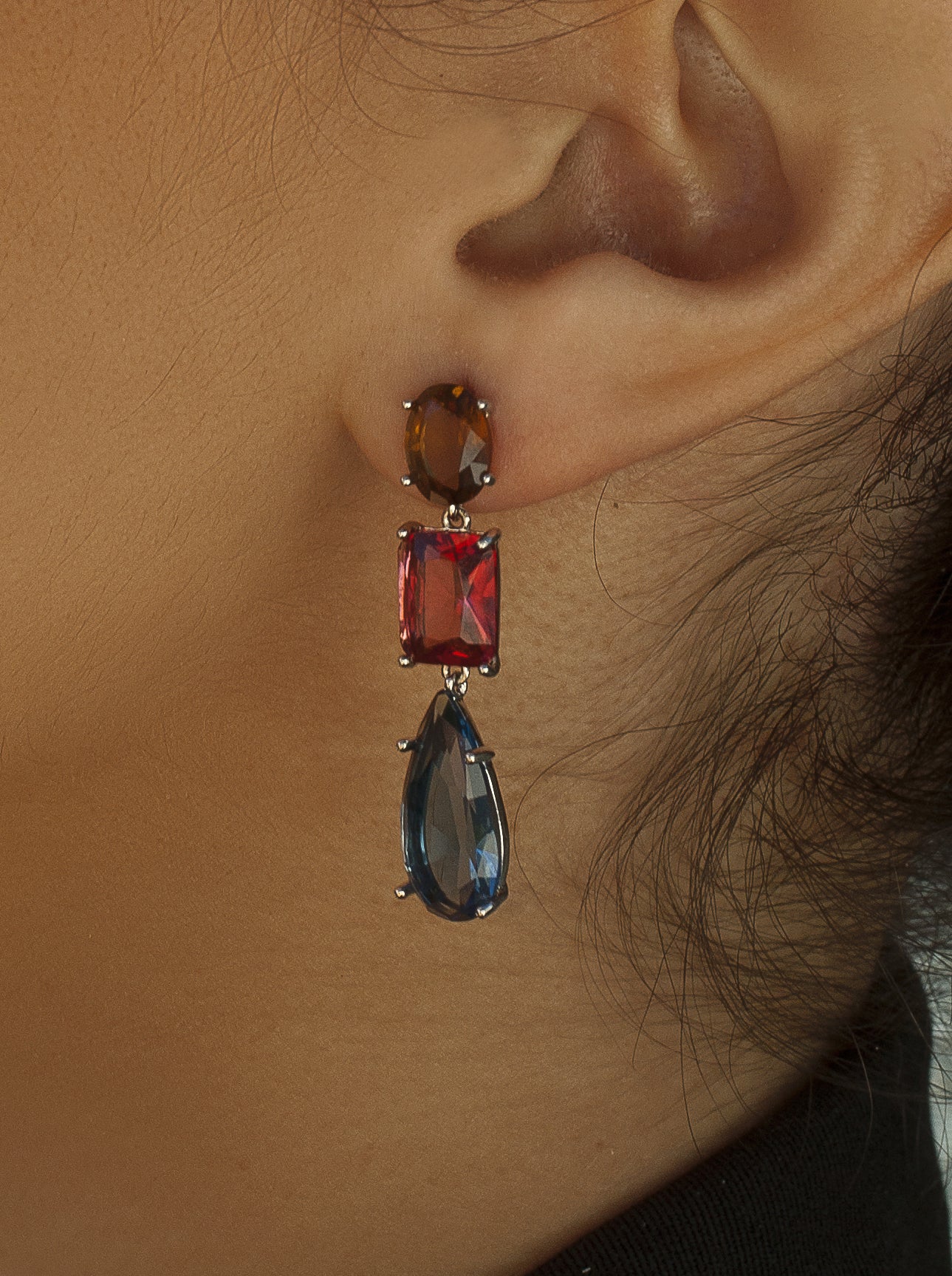 Silver earrings with colored stones in different sizes and shades