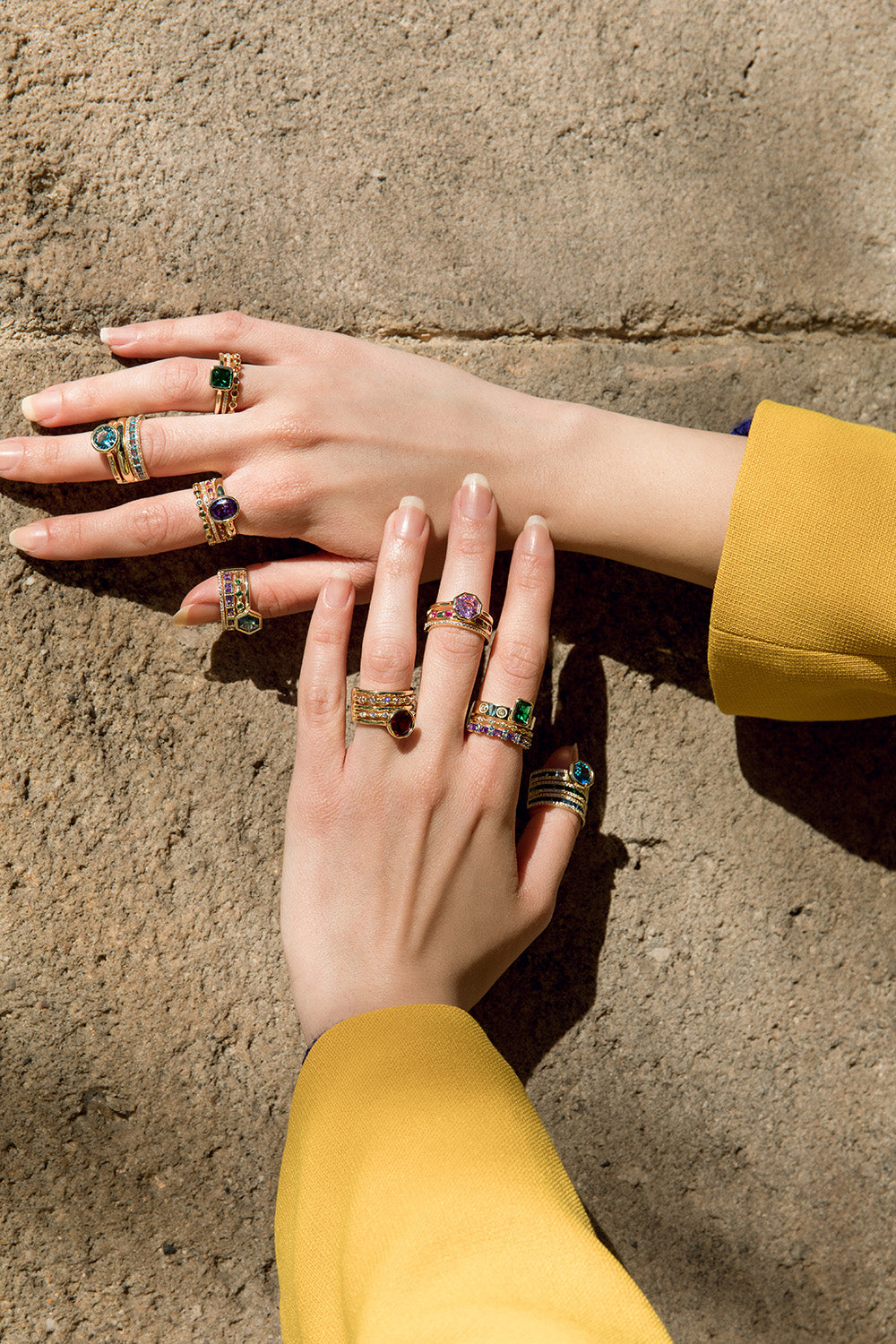 Rings with central hexagonal motif stones in a pink tone