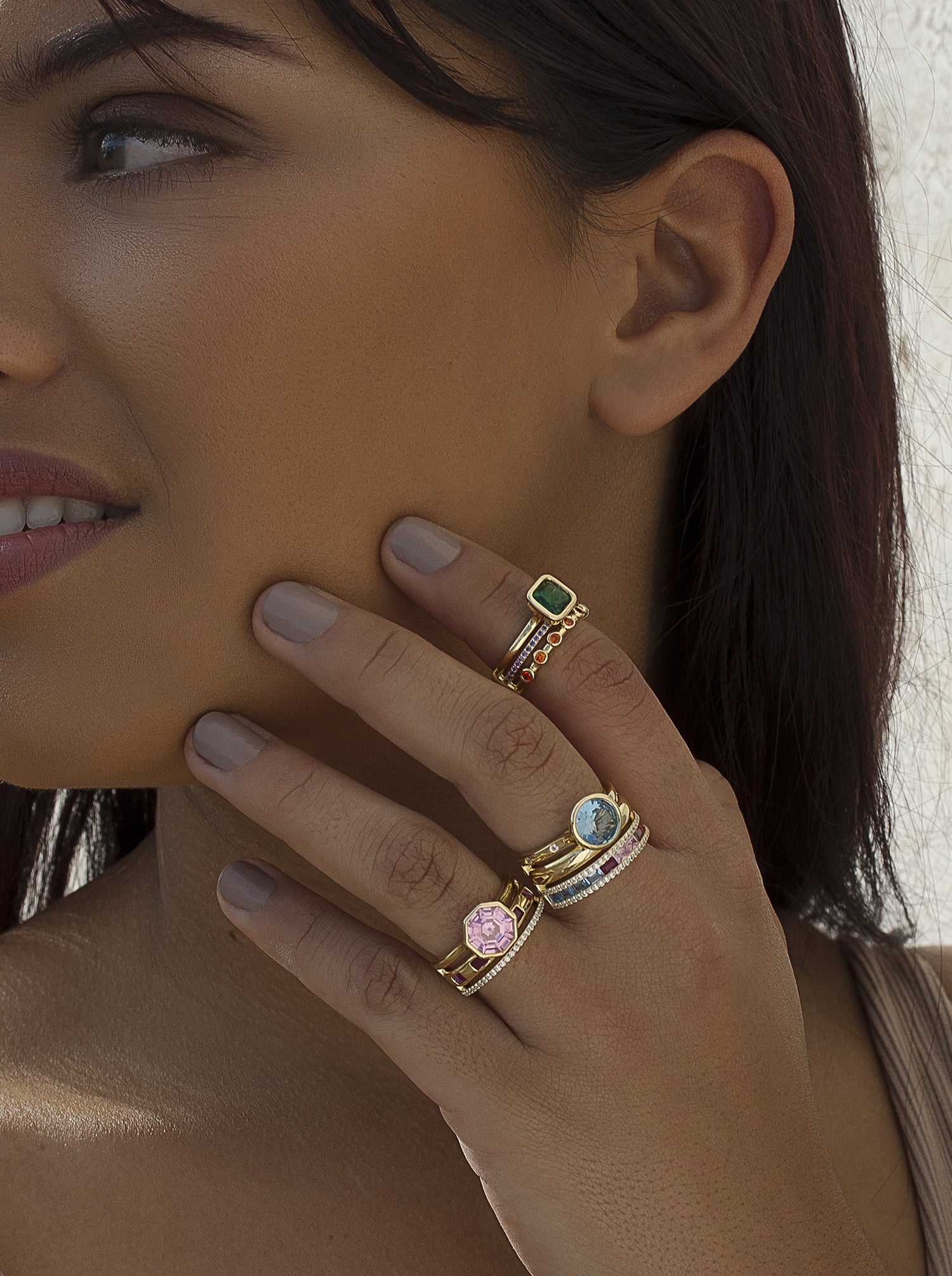 Rings with central hexagonal motif stones in a pink tone