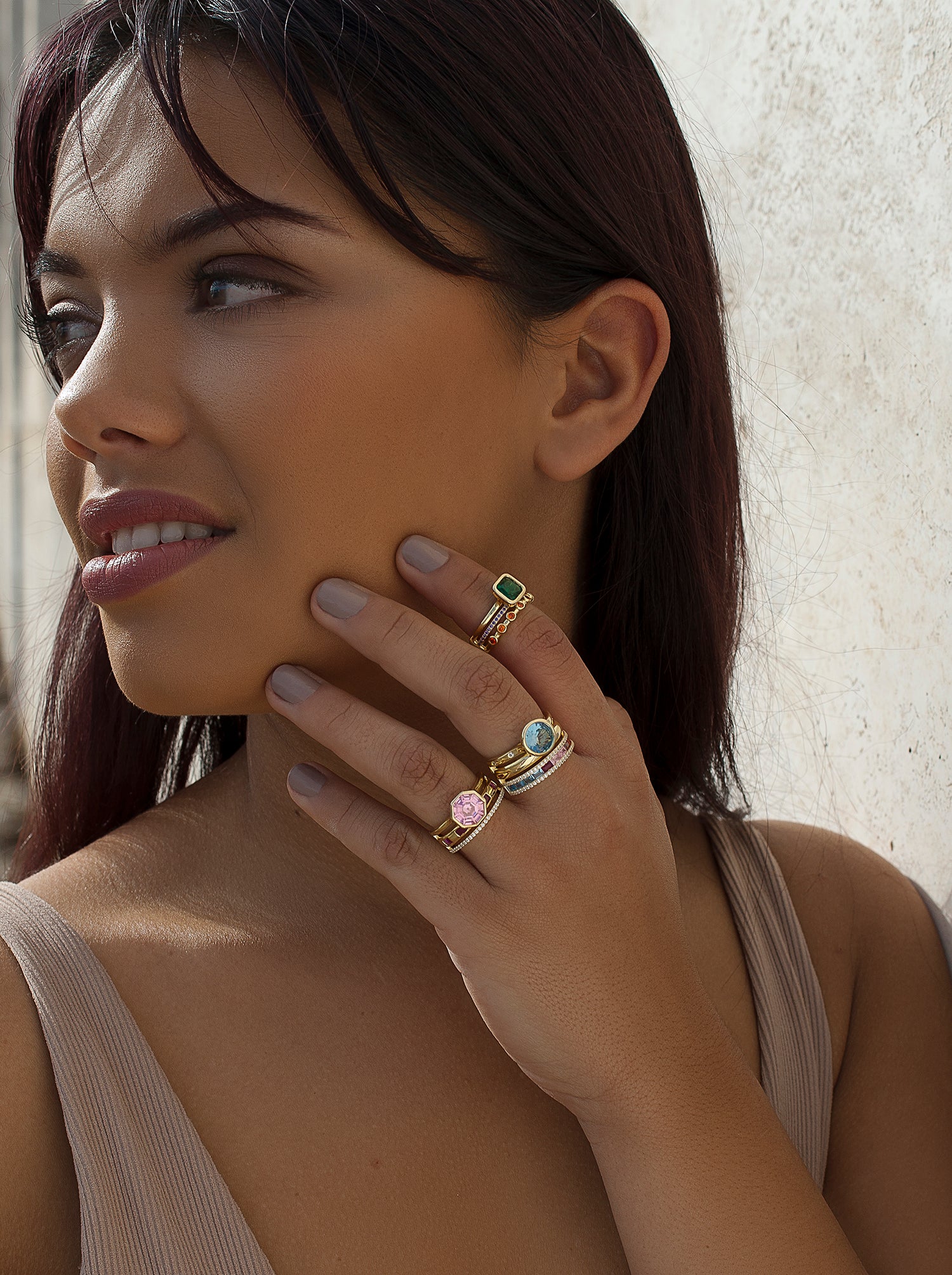 Rings with central hexagonal motif stones in a pink tone