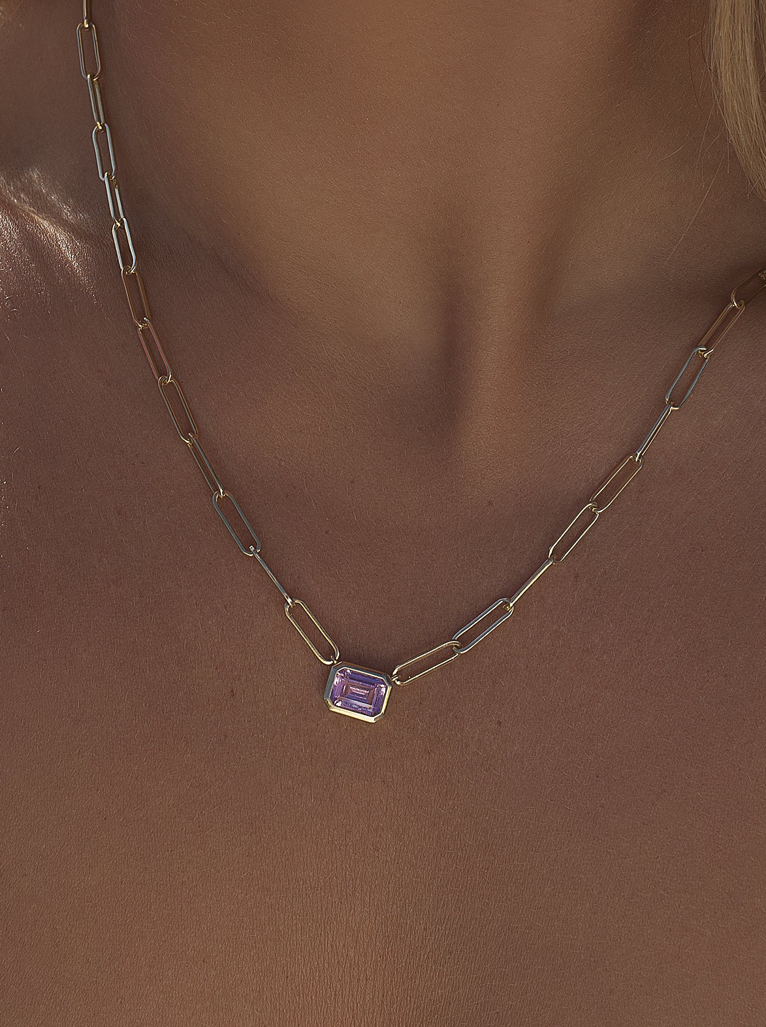 Necklaces with pink stones and a gold link design
