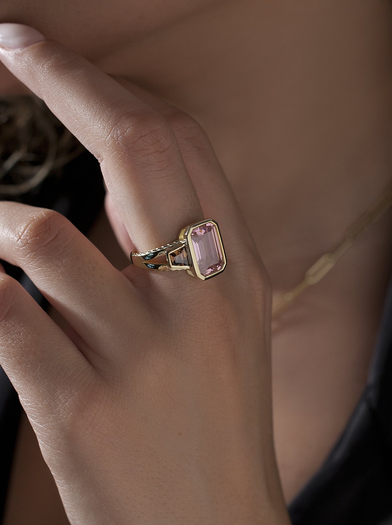 Rings with radiant cut stones in a pink tone