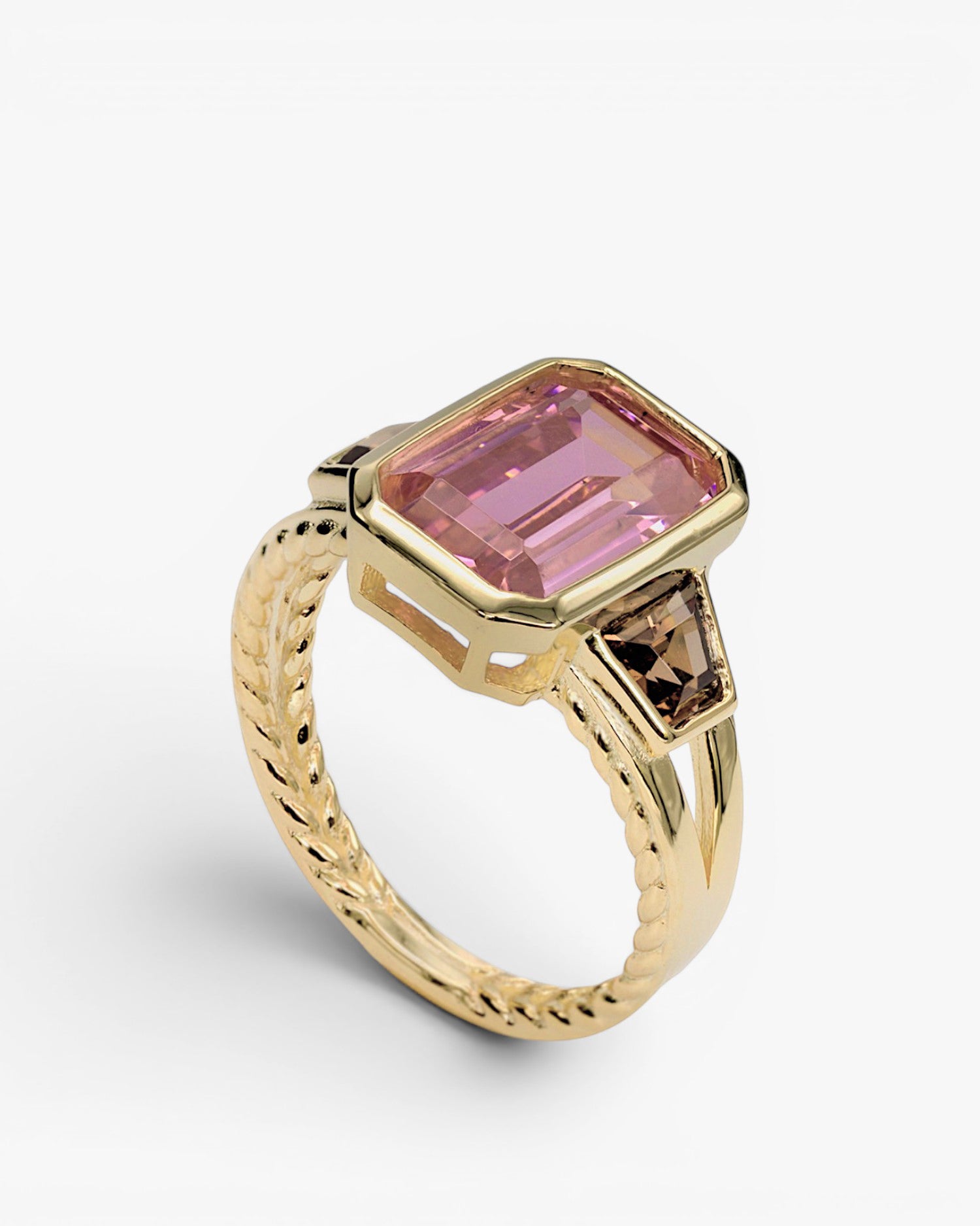 Rings with radiant cut stones in a pink tone