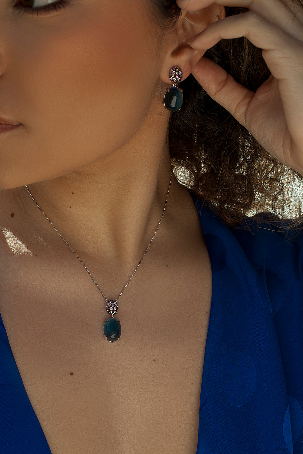 Earrings with cabochon-style pendants and cubic zirconia