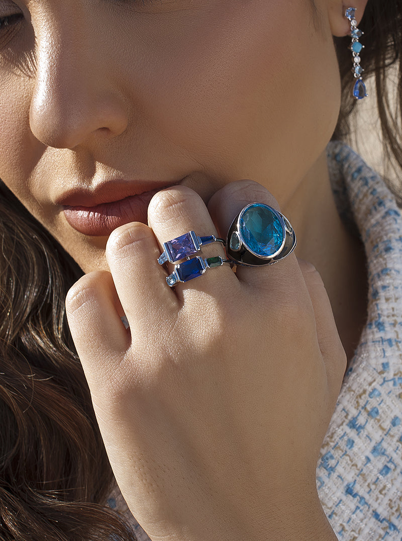 Rings with stones with aquamarine-toned gems