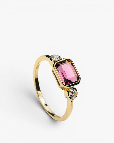 Anillos con piedras talla esmeralda tono fucsia y dos circonitas