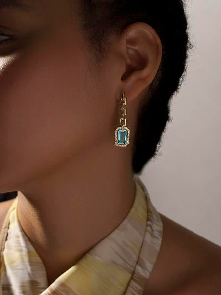 Long silver earrings with link design and aquamarine-toned gemstone