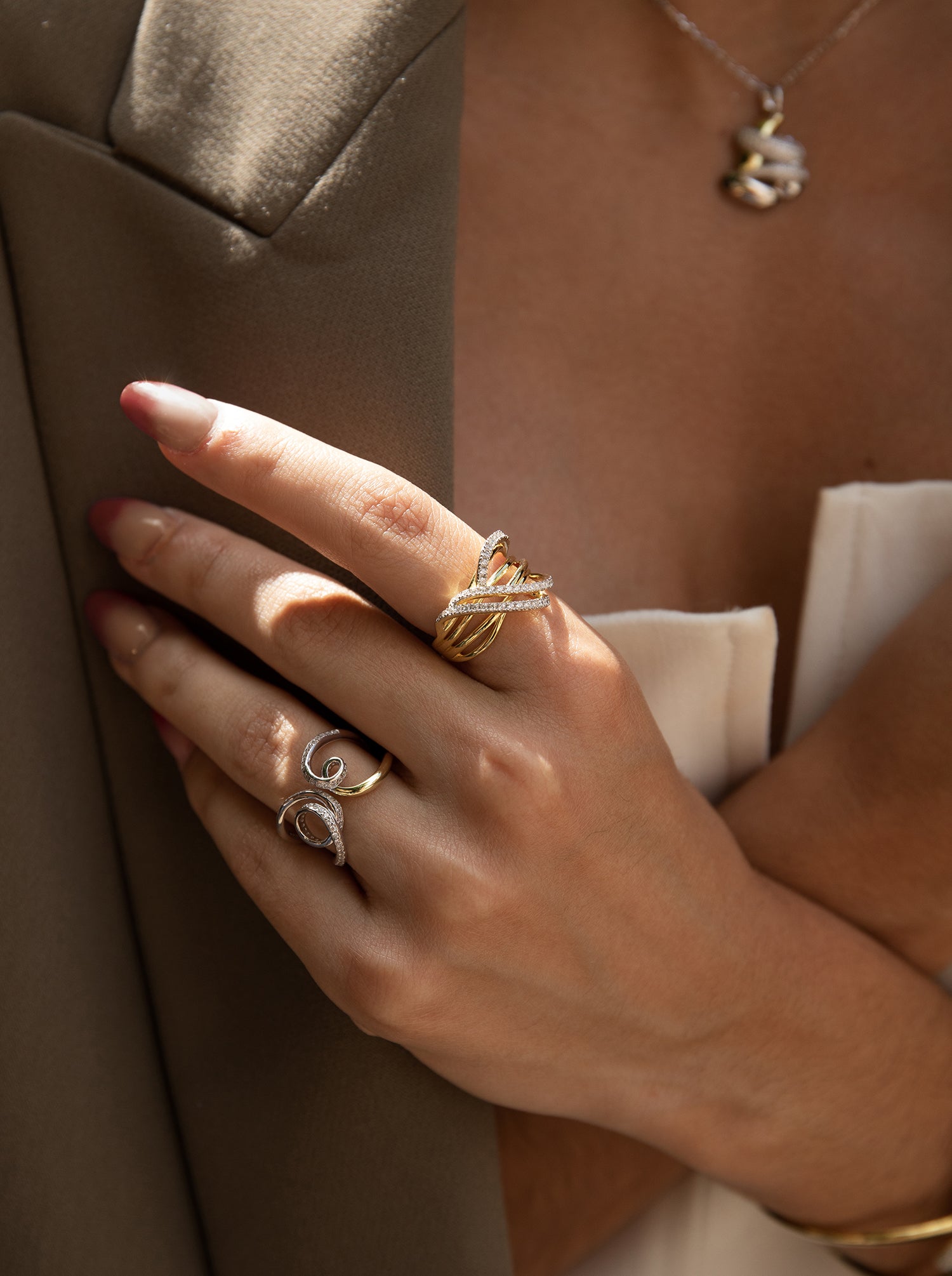 Anillos bicolor de plata diseño tirabuzones con circonitas