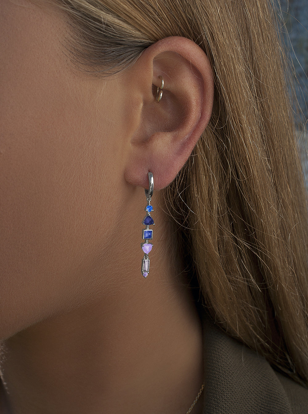 Earrings with blue tone gemstone hoop design pendants