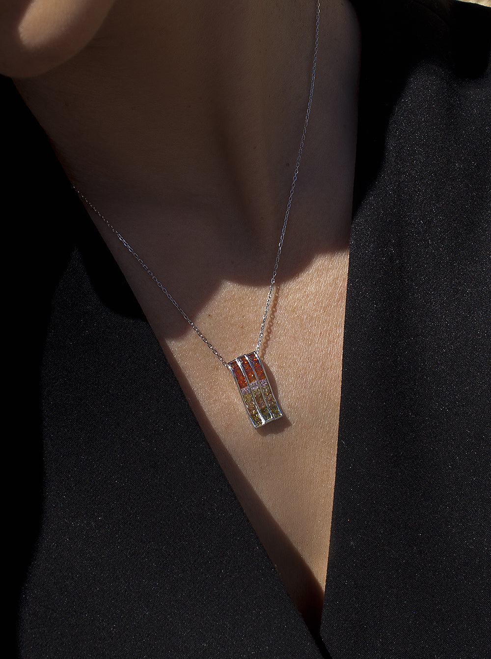 Necklaces with triple rail stones in warm tones