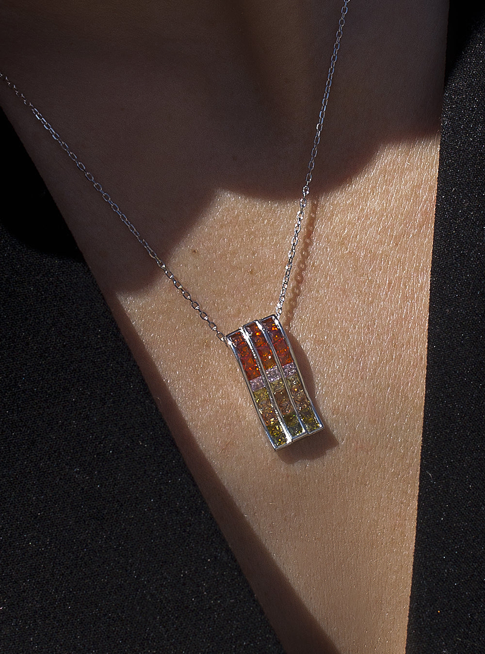 Necklaces with triple rail stones in warm tones