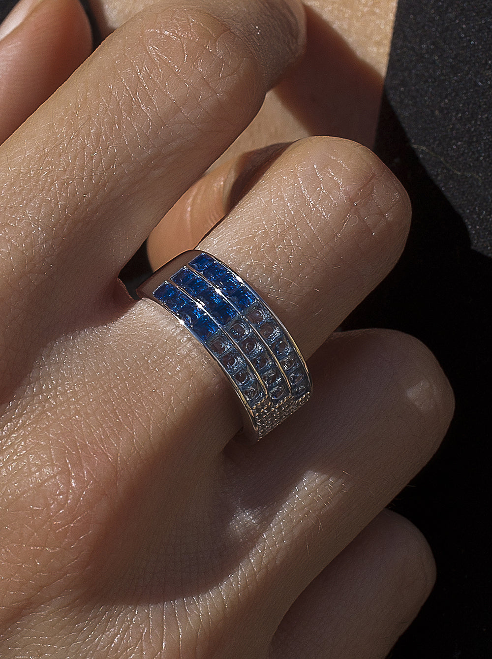 Rings with triple rail stones in shades of blue