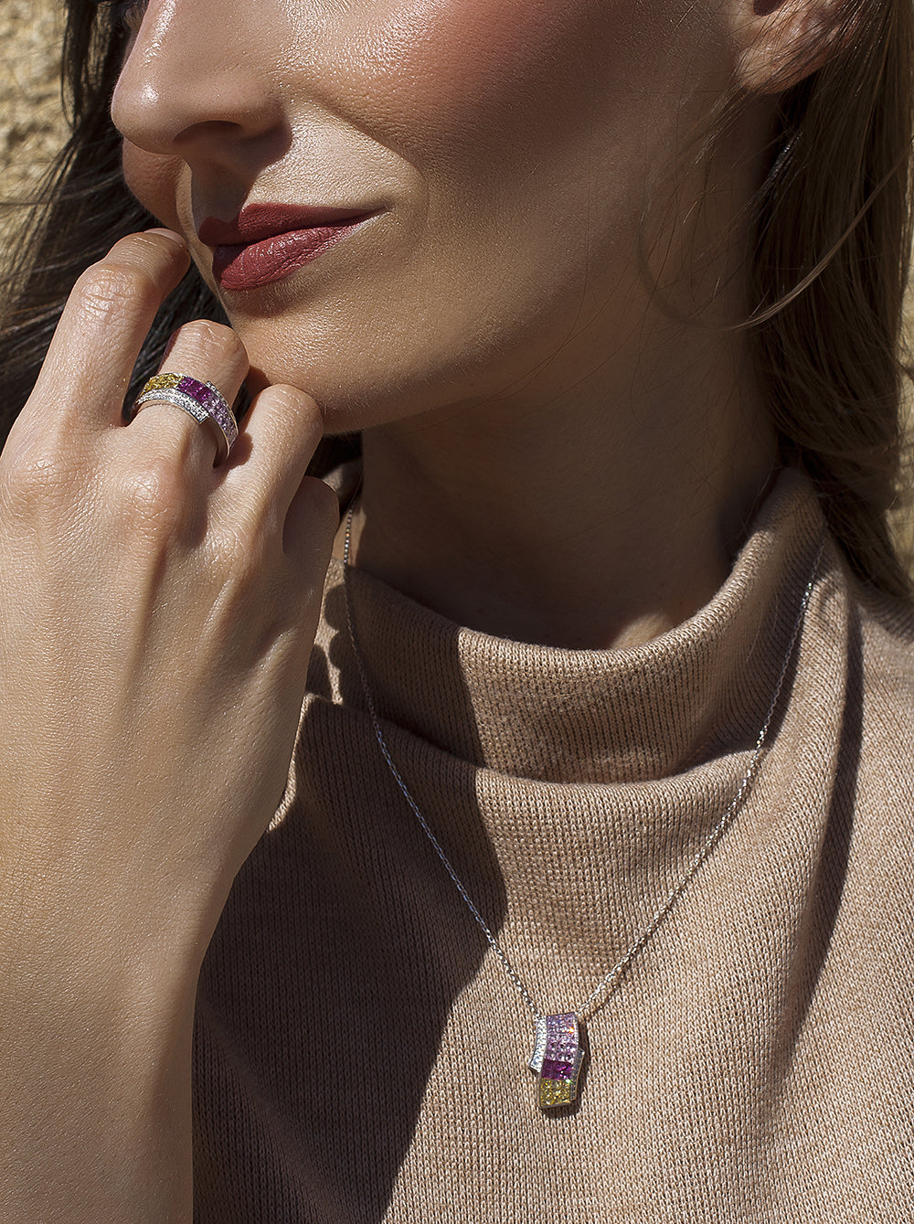 Necklaces with triple rail stones in pink tones