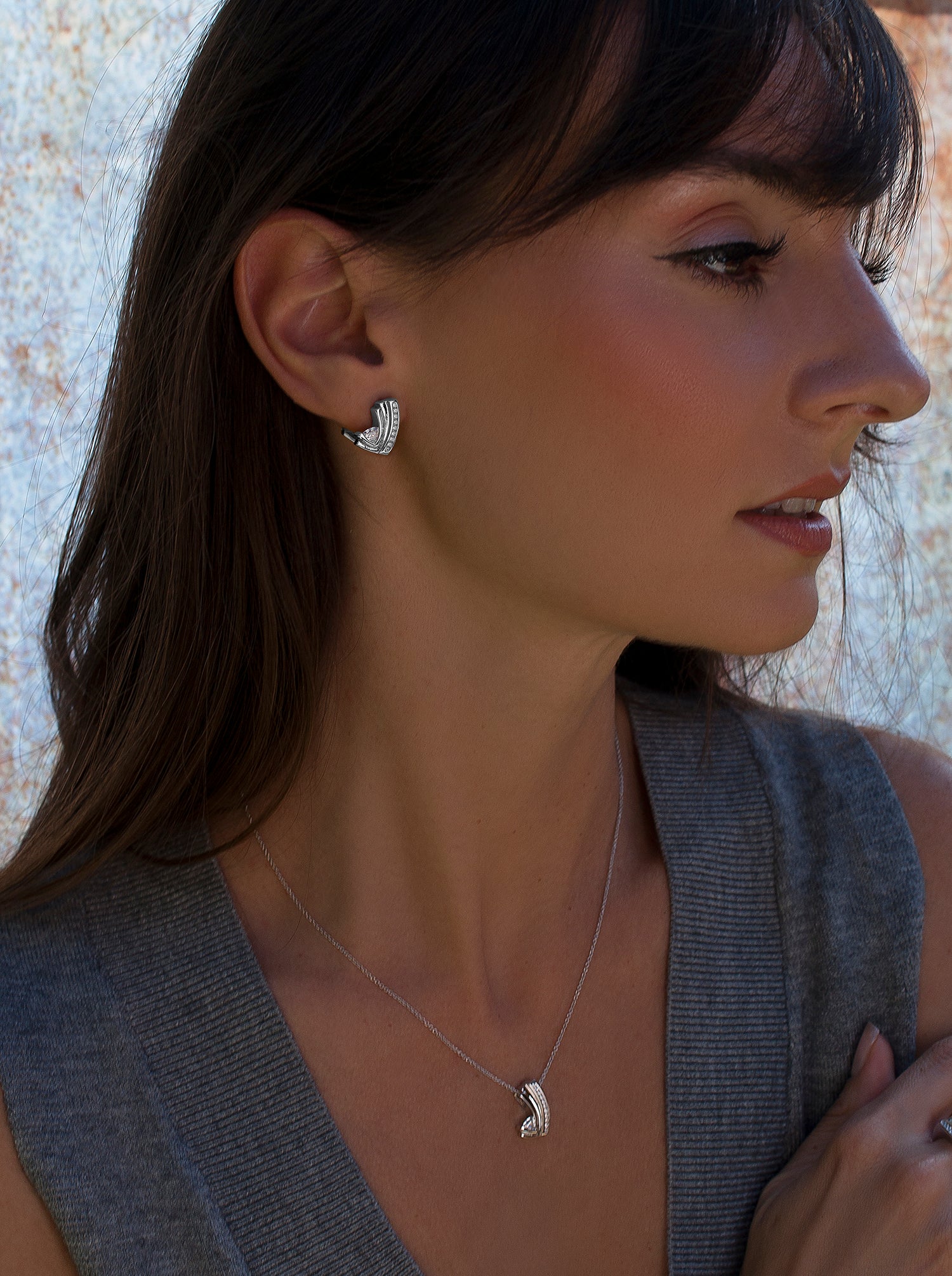 Silver omega clasp earrings with cubic zirconia detail