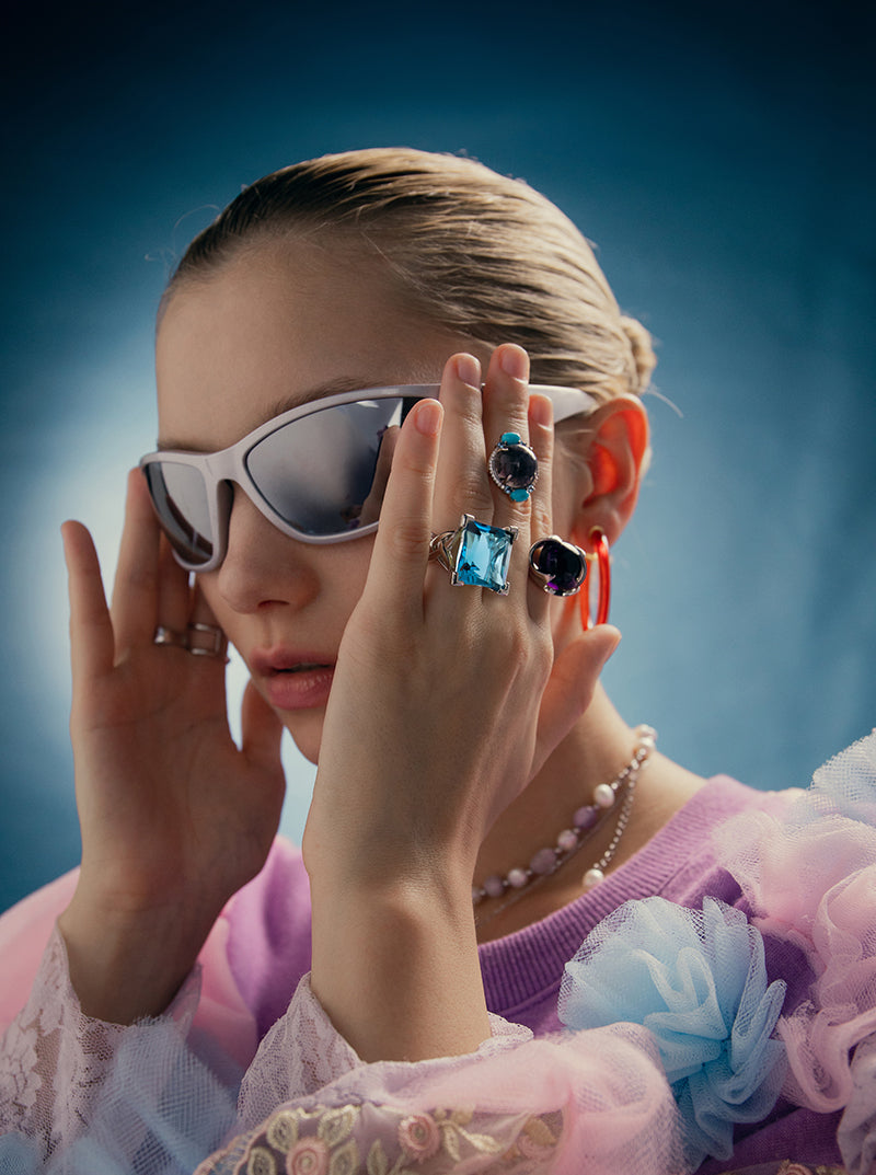 Rings with oval-shaped stones in a purple tone