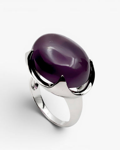 Rings with oval-shaped stones in a purple tone