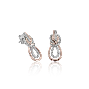 Pendientes bicolor en rosa y circonitas blancas en diseño entrelazado