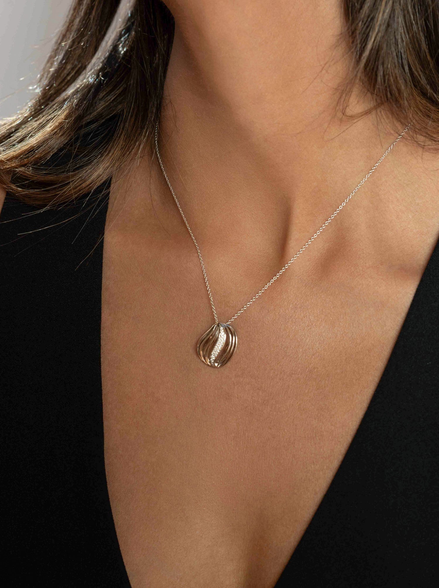 Silver necklace with waves and cubic zirconia