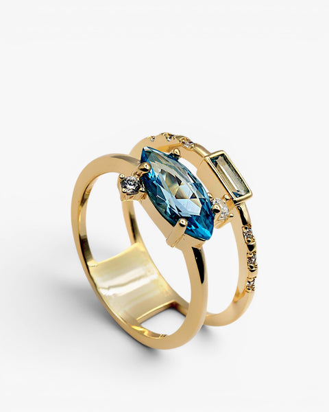 Anillo doble con piedras en tono azul