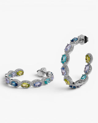 Boucles d'oreilles créoles ornées de pierres bleues et de zirconiums cubiques