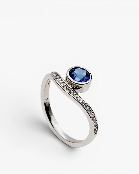 Silver ring with cubic zirconia and blue stone