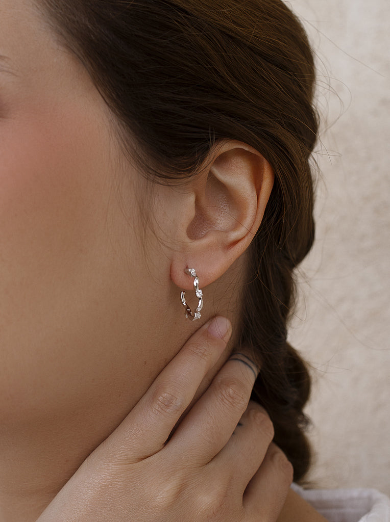 Silver earring with irregular line cubic zirconia