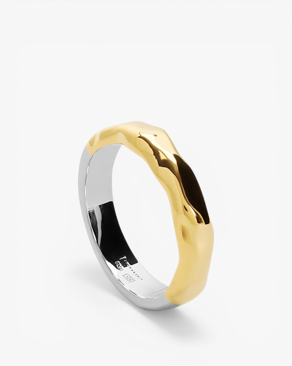 Anillo bicolor de formas orgánicas en plata y oro