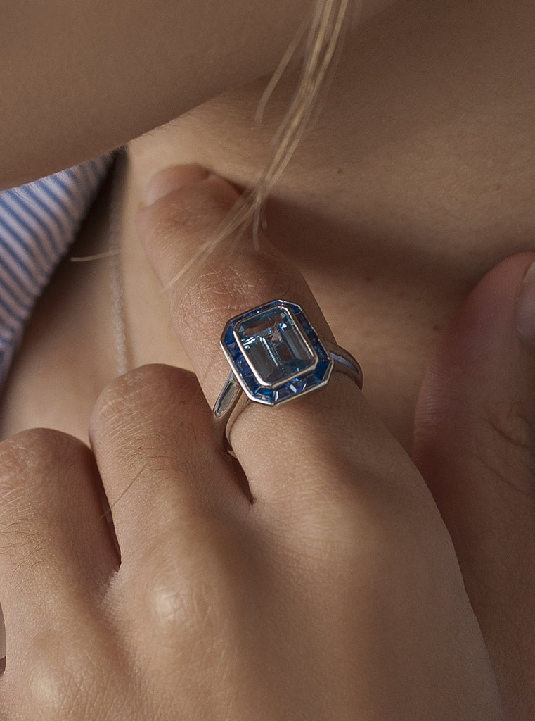 Rings with blue emerald-cut stones
