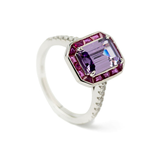 Rings with emerald-cut stones in an amethyst tone